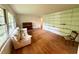 Bright living room with hardwood floors, built-in shelving, and large windows at 1333 Council Bluff Ne Dr, Atlanta, GA 30345