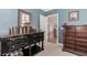 Comfortable bedroom with dressers and a desk, neutral carpet, and a large window providing ample light at 2727 Bearcreek Pl, Buford, GA 30519