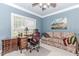 Comfortable bedroom with a desk, a sofa, neutral carpet, and a large window providing ample light at 2727 Bearcreek Pl, Buford, GA 30519