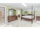 Bedroom with decorative mural, four poster bed and ensuite bathroom at 2727 Bearcreek Pl, Buford, GA 30519