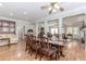 Open dining room with hardwood floors and columns that connect to the living room, offering an inviting and spacious feel at 2727 Bearcreek Pl, Buford, GA 30519