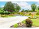 Scenic view of the landscaped front yard and driveway, showcasing lush greenery and a charming garden at 2727 Bearcreek Pl, Buford, GA 30519