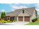 Well-maintained home with a two-car garage, screened porch, and beautifully landscaped front yard at 2727 Bearcreek Pl, Buford, GA 30519