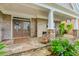 A cozy front porch featuring stone supports and brickwork, with ample space for seating at 2727 Bearcreek Pl, Buford, GA 30519