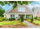 Charming, brick home featuring manicured landscaping, a walkway, and a welcoming front porch at 2727 Bearcreek Pl, Buford, GA 30519