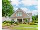 Charming, brick home featuring manicured landscaping, a walkway, and a welcoming front porch at 2727 Bearcreek Pl, Buford, GA 30519