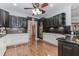 A spacious kitchen features dark upper cabinets, white lower cabinets, hardwood floors, and stainless steel appliances at 2727 Bearcreek Pl, Buford, GA 30519