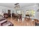 A spacious living room featuring hardwood floors, a cozy fireplace and comfortable seating at 2727 Bearcreek Pl, Buford, GA 30519