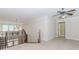 Open loft area with chandelier and carpet flooring at 2727 Bearcreek Pl, Buford, GA 30519