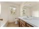 Bright bathroom featuring a vanity with ample counter space, and natural light from large window at 4354 Revere Cir, Marietta, GA 30062