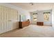 Empty bedroom with carpeted floors, double door closet, and dresser storage at 4354 Revere Cir, Marietta, GA 30062