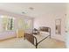 This bedroom features large windows offering ample natural light, plus neutral walls and carpet at 4354 Revere Cir, Marietta, GA 30062