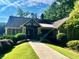 Charming community clubhouse with a welcoming entrance and manicured landscaping creating a serene atmosphere at 4354 Revere Cir, Marietta, GA 30062