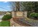 Elegant stone sign for Chimney Springs community with landscaped flower beds adding charm and curb appeal at 4354 Revere Cir, Marietta, GA 30062