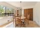 Bright dining room with large windows, classic light fixture, and wooden table and chairs at 4354 Revere Cir, Marietta, GA 30062