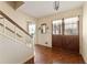 Inviting foyer featuring parquet floors, stairs, and a unique double-door entry at 4354 Revere Cir, Marietta, GA 30062