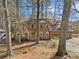 Traditional two-story home with a brown facade, covered entry, and attached two-car garage at 4354 Revere Cir, Marietta, GA 30062