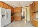 Kitchen featuring tile flooring, wooden cabinets, and modern appliances at 4354 Revere Cir, Marietta, GA 30062