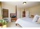 Comfortable bedroom featuring a four-poster bed and modern television at 6110 Read Rd, Suwanee, GA 30024