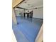 Spacious garage featuring an epoxy floor, ample storage, and access to the interior at 6110 Read Rd, Suwanee, GA 30024