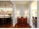 View of hallway between kitchen and dining room with hardwood flooring at 6110 Read Rd, Suwanee, GA 30024