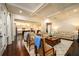 Spacious living room with hardwood floors, coffered ceilings, and an open concept design at 6110 Read Rd, Suwanee, GA 30024