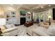 Comfortable living room with built-in shelves, fireplace and French doors to a patio at 6110 Read Rd, Suwanee, GA 30024