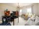 Comfortable home office with built-in bookshelves and a cozy sitting area at 6110 Read Rd, Suwanee, GA 30024