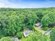 Aerial view of a charming home with lush greenery, a manicured lawn, and an additional building at 3605 Hickory Se Cir, Smyrna, GA 30080