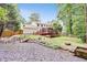Sprawling backyard features a deck, firepit, and beautiful landscaping at 3605 Hickory Se Cir, Smyrna, GA 30080