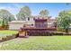 This spacious backyard includes a deck, a screened in porch and wooded scenery at 3605 Hickory Se Cir, Smyrna, GA 30080