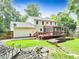 Large, private backyard featuring multi level deck with screened porch and wooded views at 3605 Hickory Se Cir, Smyrna, GA 30080
