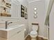 Contemporary half bathroom with modern fixtures, stylish decor, and clean lines at 3605 Hickory Se Cir, Smyrna, GA 30080