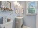 Bathroom featuring natural light, light blue walls, and tile floors at 3605 Hickory Se Cir, Smyrna, GA 30080