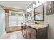 Bathroom featuring a double vanity with dark wood cabinets, granite countertops and tile floor at 3605 Hickory Se Cir, Smyrna, GA 30080