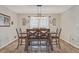 Traditional dining room featuring wood floors, neutral paint, and a modern light fixture at 3605 Hickory Se Cir, Smyrna, GA 30080