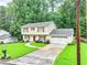 Charming two-story home with red shutters, well-manicured lawn, and a two-car garage at 3605 Hickory Se Cir, Smyrna, GA 30080