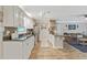 Spacious kitchen with granite counters, stainless steel appliances and hardwood floors flowing into the living area at 3605 Hickory Se Cir, Smyrna, GA 30080