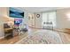 Bright living room featuring modern decor, hardwood floors, large rug and entertainment area with large TV at 3605 Hickory Se Cir, Smyrna, GA 30080
