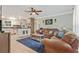 Comfortable living room featuring hardwood floors, neutral paint, and open floorplan with view of kitchen island at 3605 Hickory Se Cir, Smyrna, GA 30080