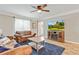 Cozy living room featuring hardwood floors, neutral paint, an entertainment center, and comfortable seating at 3605 Hickory Se Cir, Smyrna, GA 30080