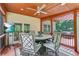 Covered patio with seating area, ceiling fan and tv, ideal for outdoor dining and entertainment at 3605 Hickory Se Cir, Smyrna, GA 30080