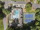 Aerial view of community pool and tennis courts with plenty of lounge chairs at 3899 Carlton Dr, Chamblee, GA 30341