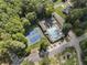 Overhead view of pool and tennis courts with trees, parking, and neighborhood streets at 3899 Carlton Dr, Chamblee, GA 30341