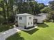 Aerial view of home with a driveway and large front yard at 3899 Carlton Dr, Chamblee, GA 30341