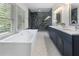 Spacious bathroom featuring a soaking tub, a walk-in shower, and double sinks at 3899 Carlton Dr, Chamblee, GA 30341