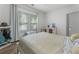 Cozy bedroom featuring a comfortable bed, a window with natural light, and hardwood floors at 3899 Carlton Dr, Chamblee, GA 30341