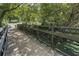 Scenic wooden bridge surrounded by lush greenery and trees at 3899 Carlton Dr, Chamblee, GA 30341