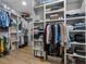 Spacious walk-in closet with custom shelving, rods, and drawers for optimal storage and organization at 3899 Carlton Dr, Chamblee, GA 30341