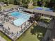 Community pool with tennis courts, lots of chairs, and shady umbrellas at 3899 Carlton Dr, Chamblee, GA 30341